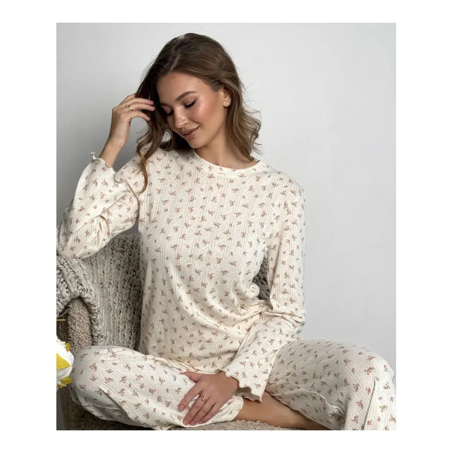 Women's white floral print bell sleeve round neck top and wide leg pants loungewear suit on model