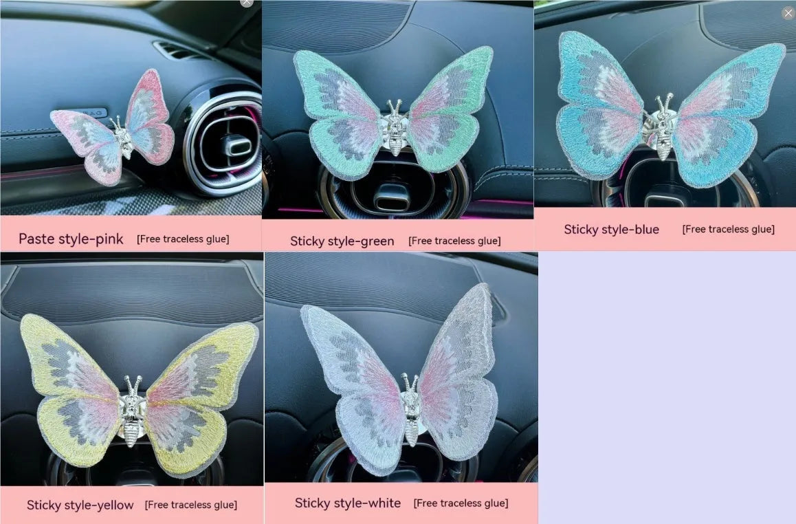 Fabric embroidered butterfly car air vent decoration in multiple colour options on a dashboard.