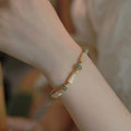Women's Hetian jade bracelet with white round beads in simple geometric design