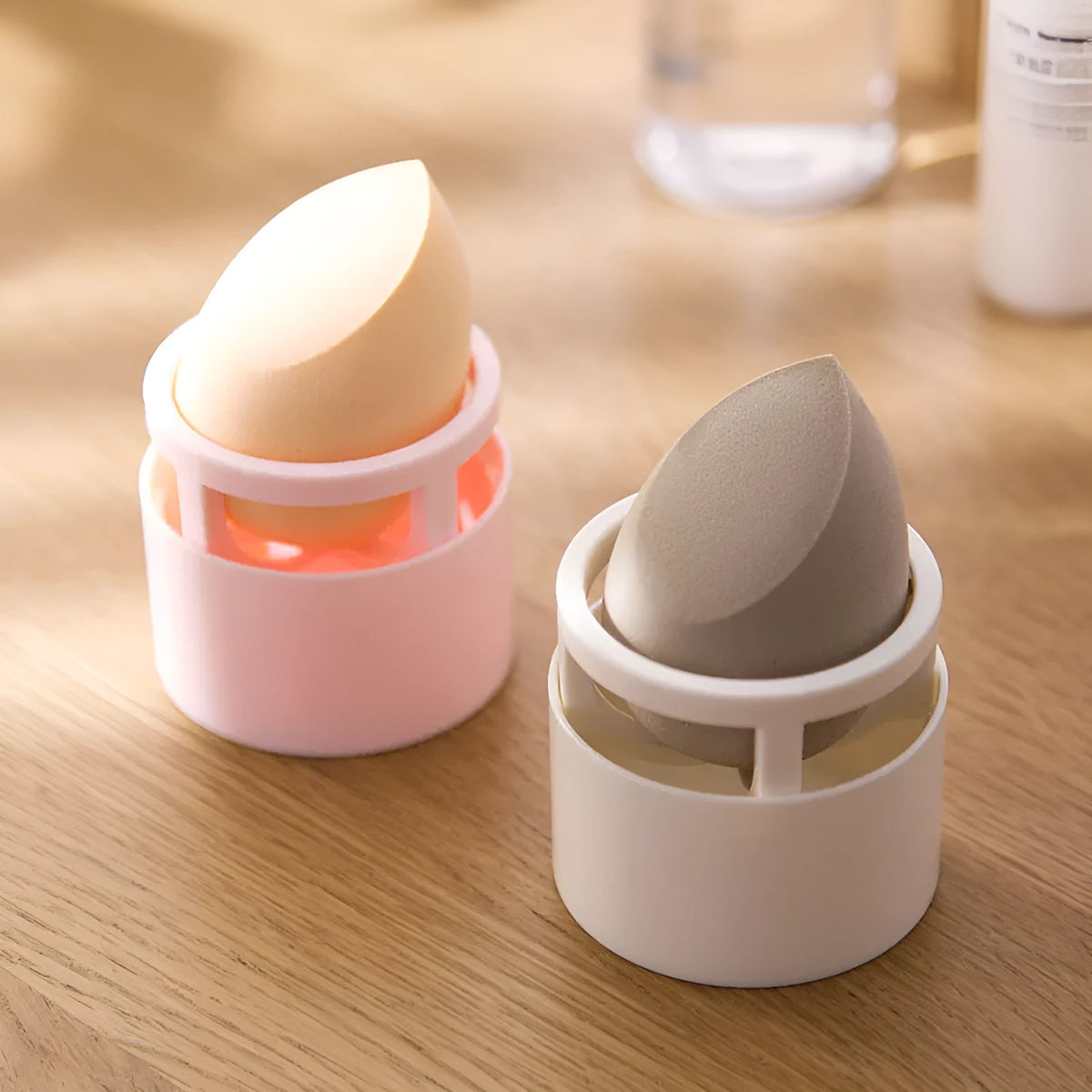 Pink plastic beauty egg stand in girly heart style for dustproof cosmetics storage on a bedroom surface