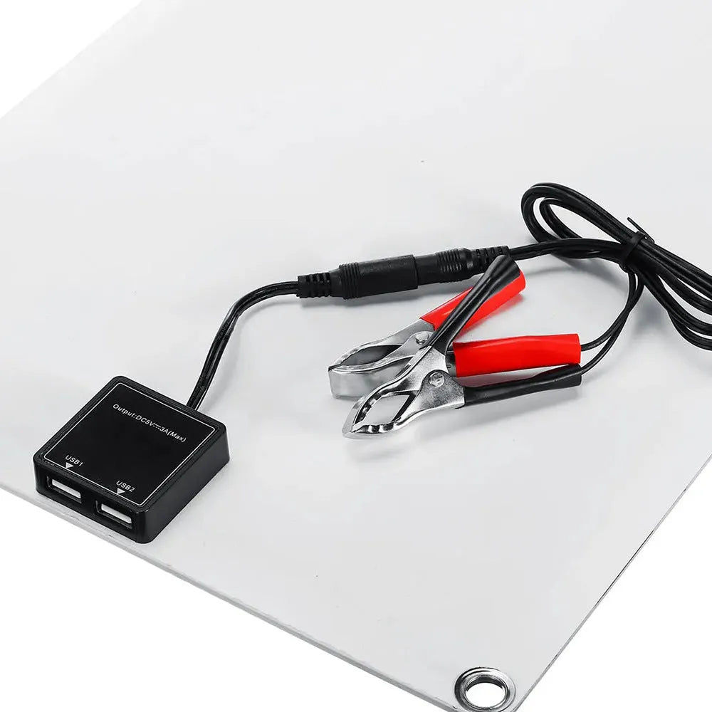 30W semi-flexible solar panel showing USB port and 18V output cable for outdoor charging.