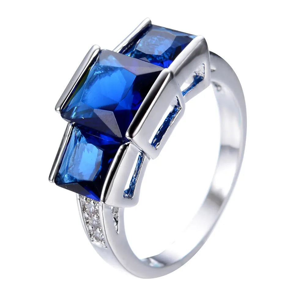 Geometric wholesale ring ornament in electroplated copper showing multiple colour options on a size 8 finger