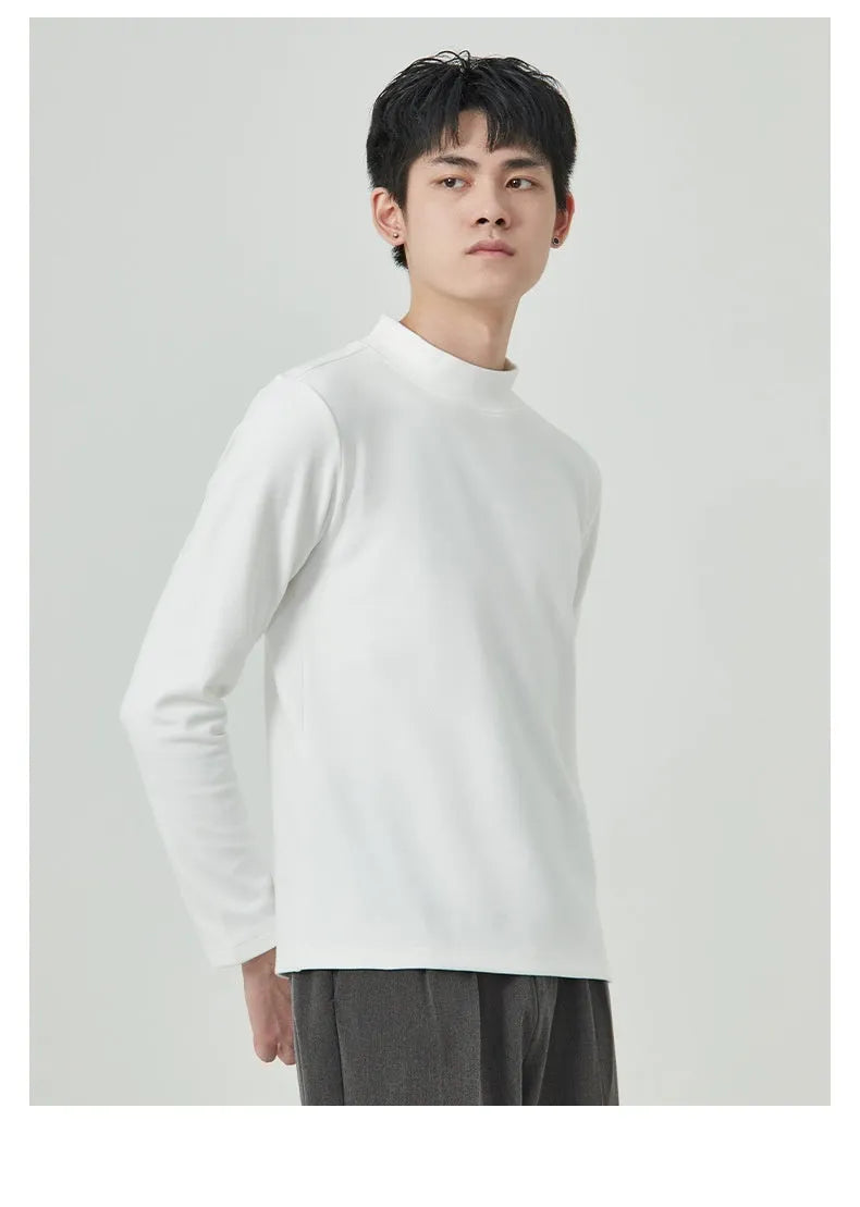 Men's brown Dralon fabric long sleeve t-shirt with a half-high collar on a hanger.
