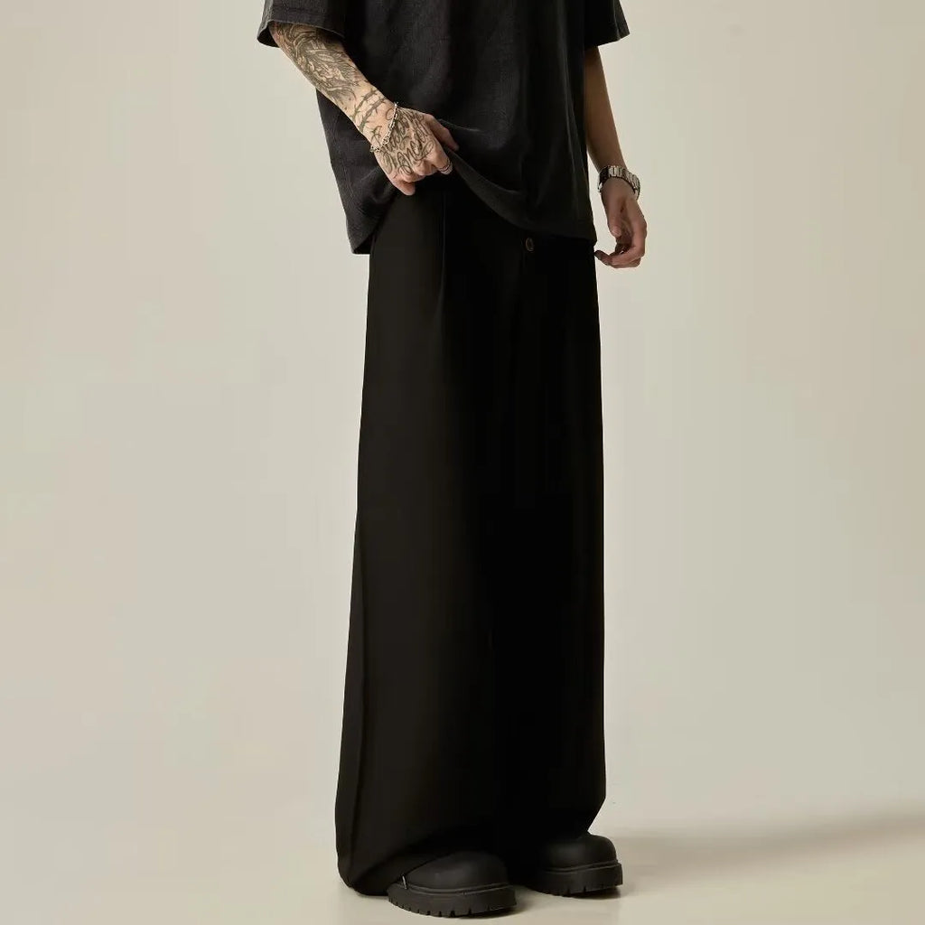 Men's solid colour straight-leg trousers in cotton-polyester blend fabric shown in black and brown colours