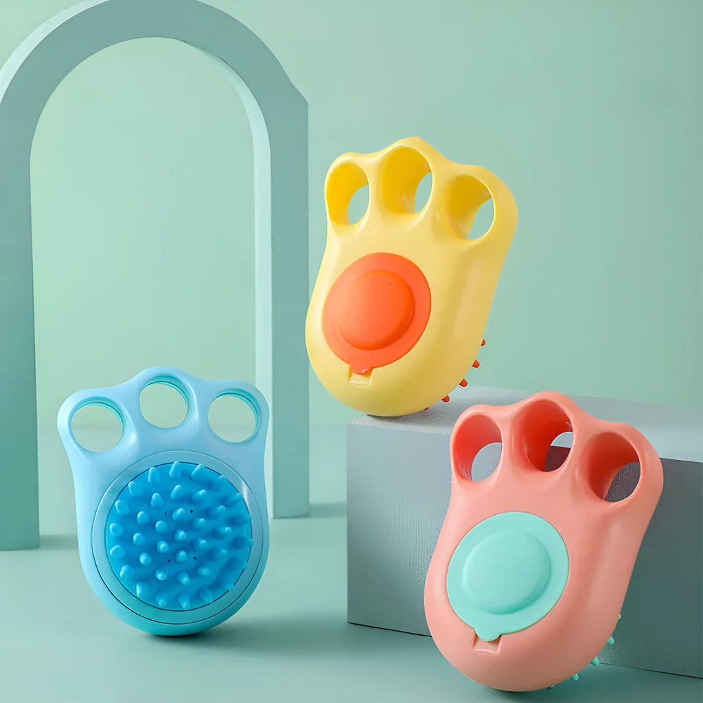 Blue pet bath and massage brush with silicone bristles and an ergonomic non-slip handle.