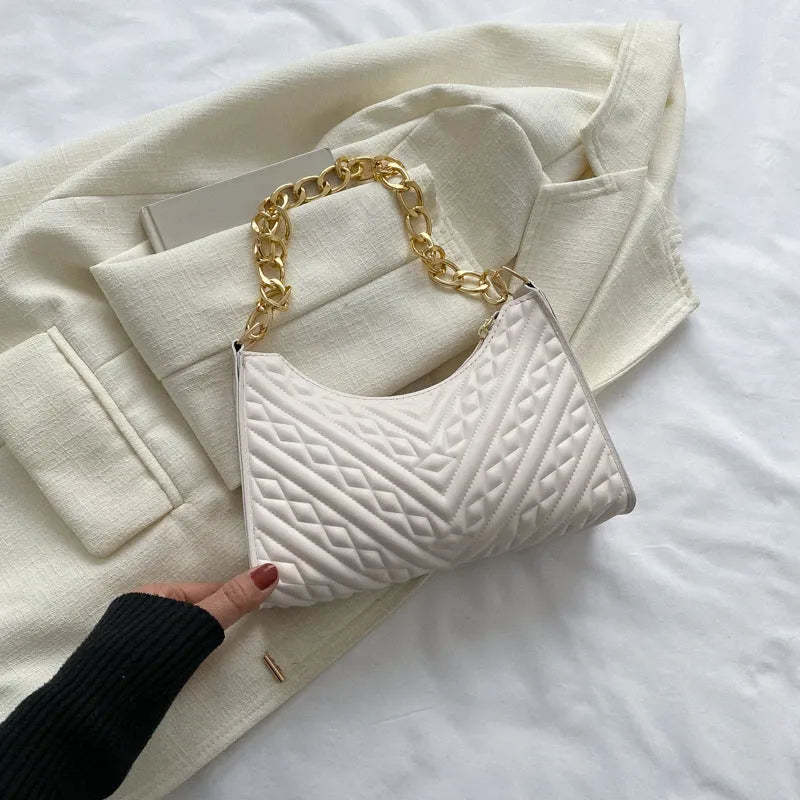 Brown PU pleated chain baguette shoulder bag showing vertical square shape and soft carry handle.