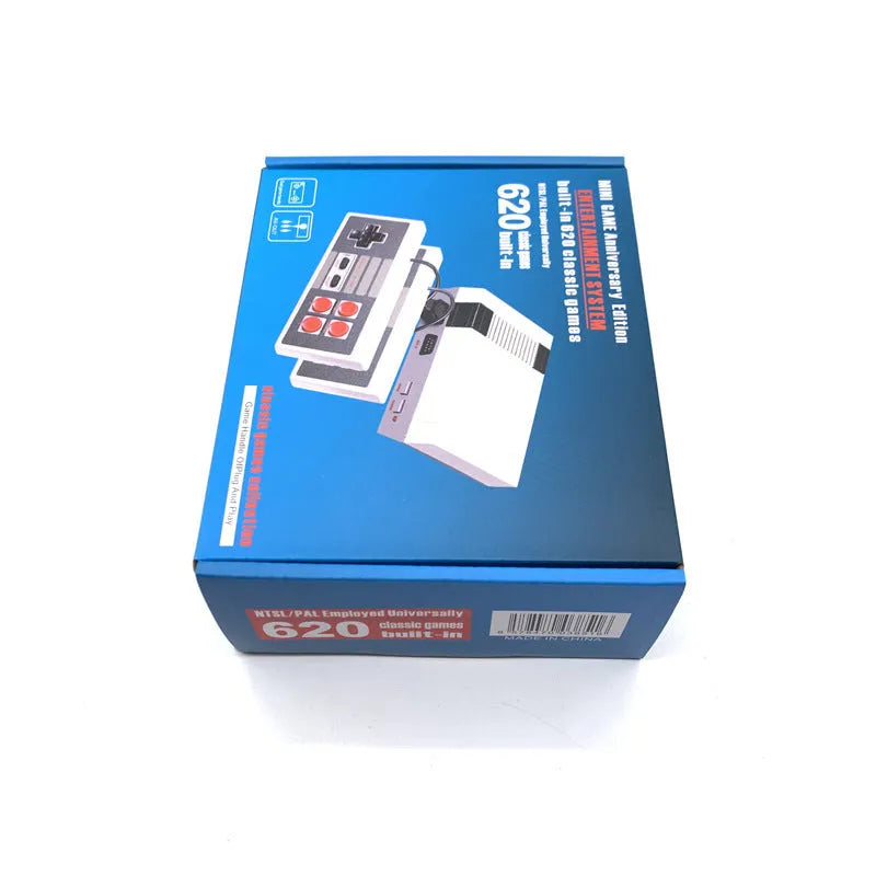 Compact black retro NES game console with two rectangular controllers on a white background.