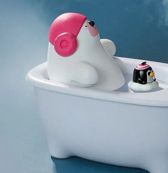 White plastic USB desktop air humidifier and essential oil diffuser on a wooden table.