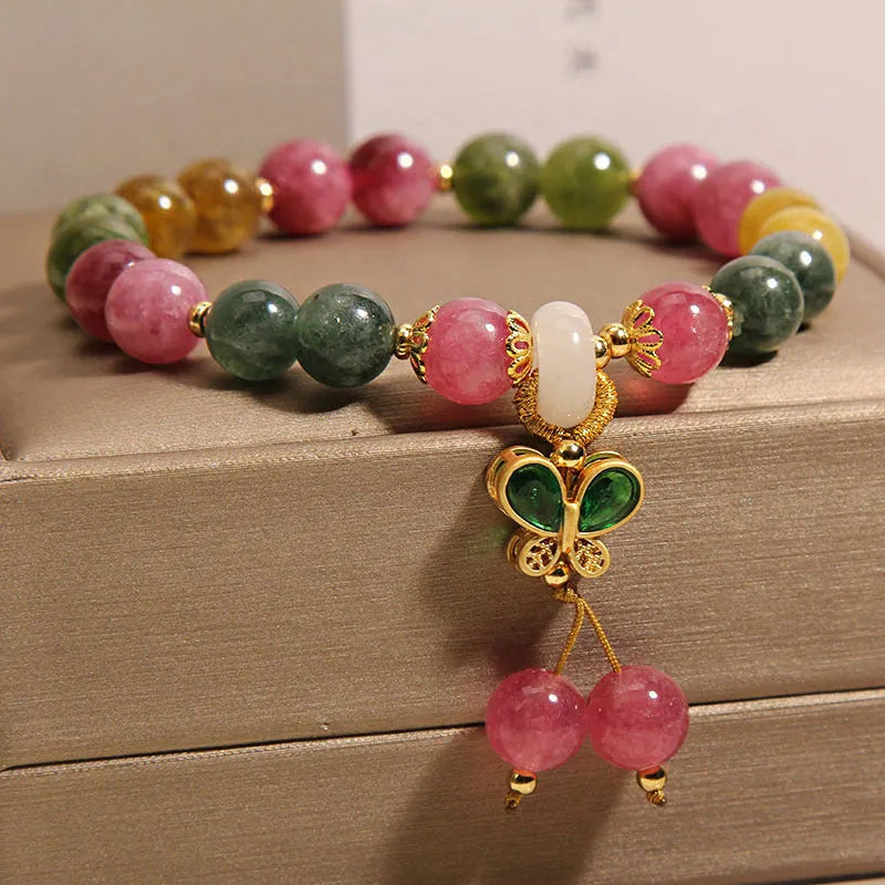 Women's tourmaline bracelet with a natural jade colour butterfly pendant and rhinestone details.