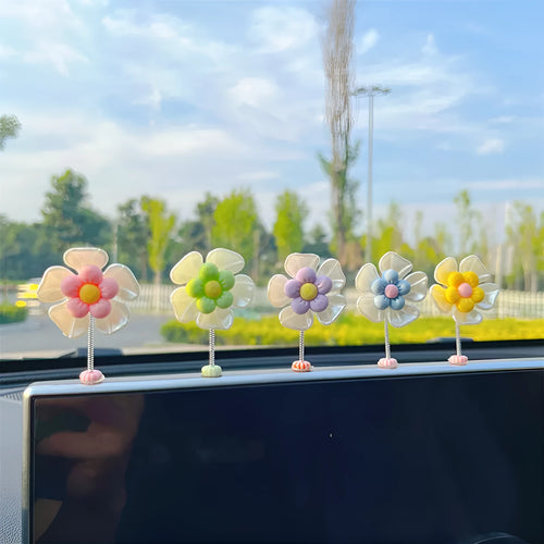 Cute plastic swing car decoration in blue, showing approximate 5cm height.