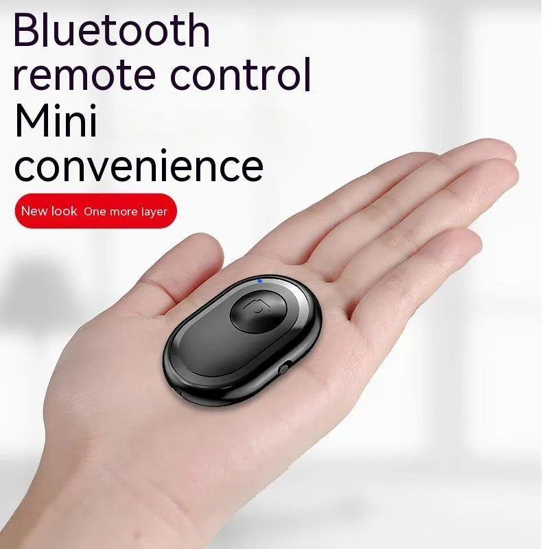 Wireless Bluetooth photo remote control in black, pink, or purple colours showing compact size