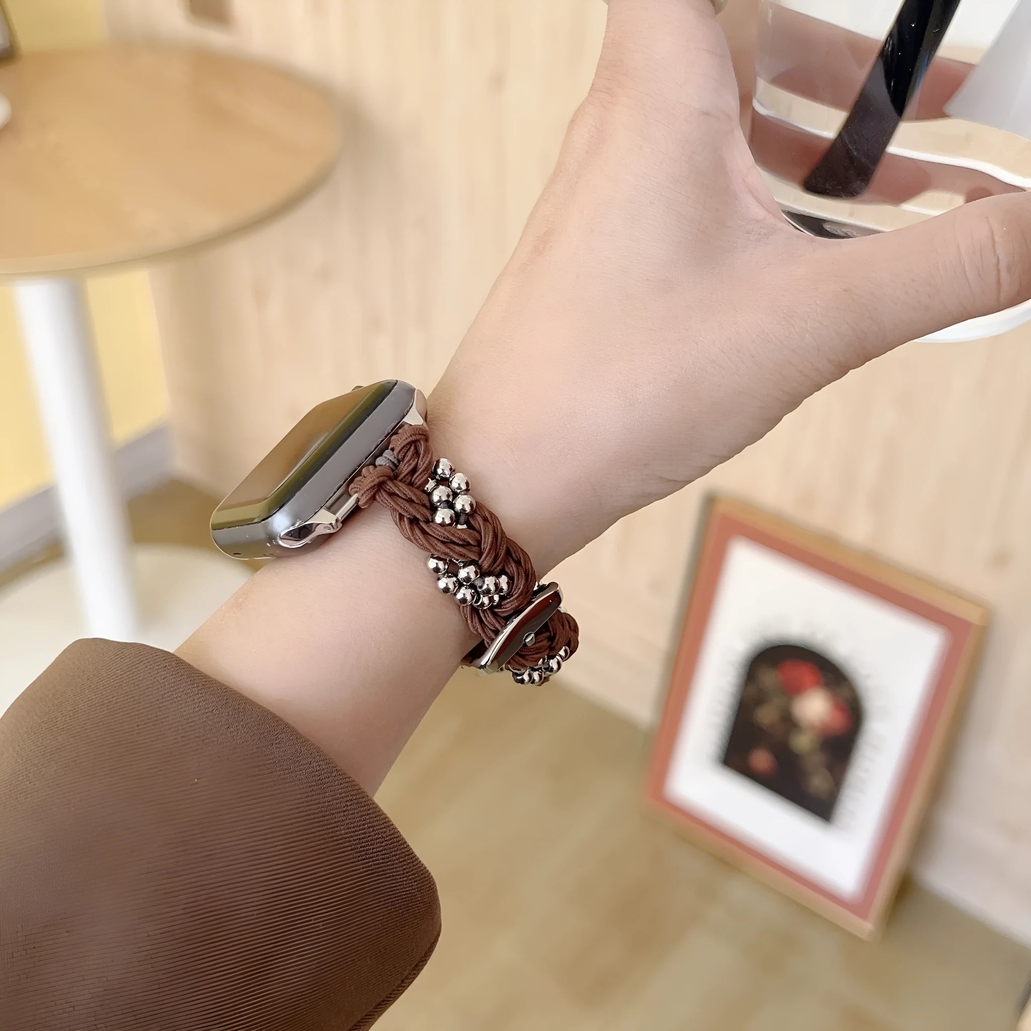 Grey elastic steel ball chain watch strap on wrist compatible with Apple Watch 38mm to 45mm