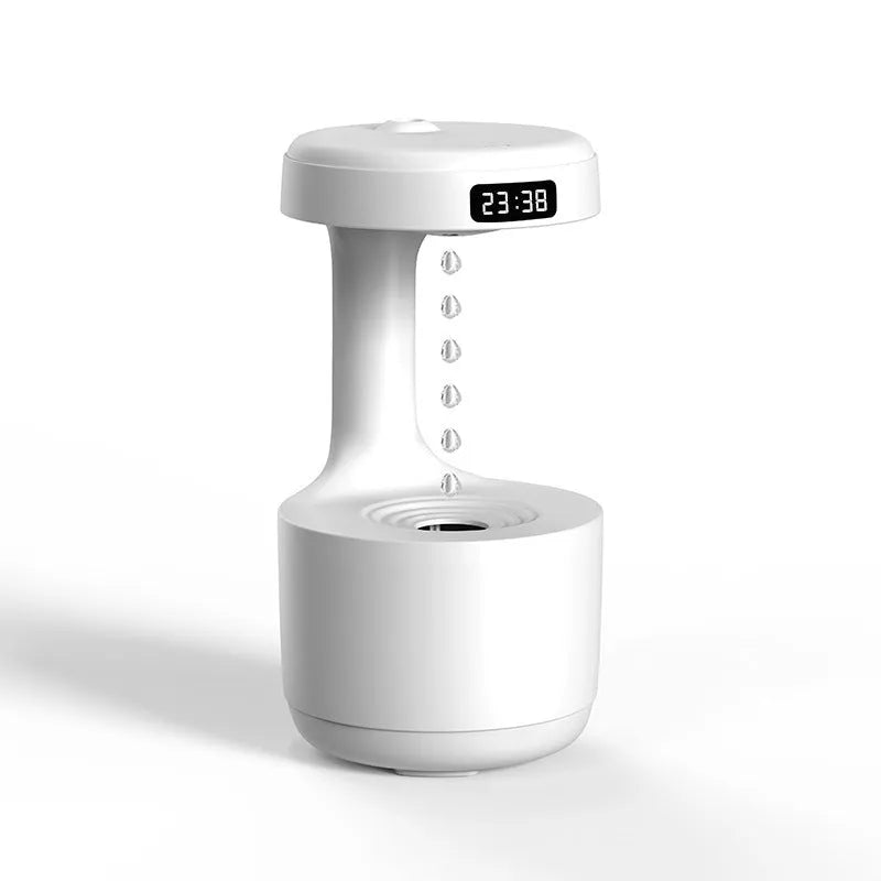 Rose gold and white levitating water drops ultrasonic humidifier and LED night light on a desk