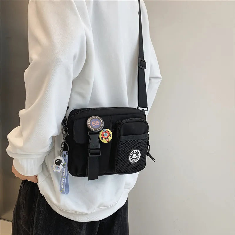 Casual nylon messenger bag for men women waterproof lightweight 22x6x17cm with badge pendants in beige black blue gray