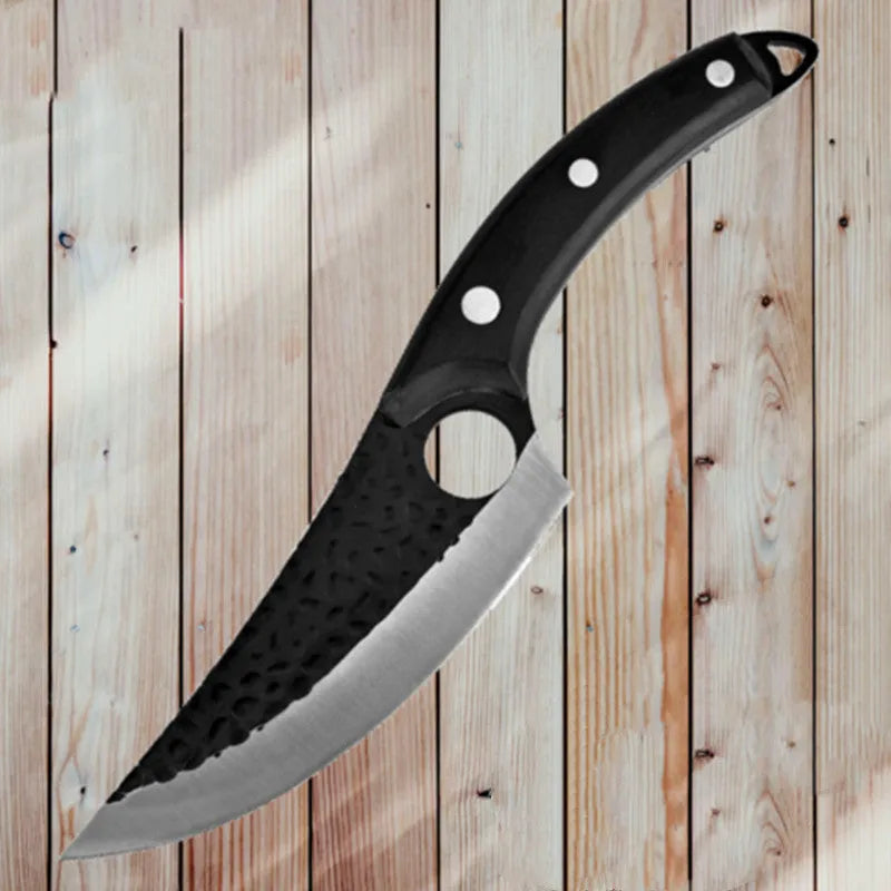Curved boning butcher knife with hammer-pattern blade and brown leather sheath on a cutting board.