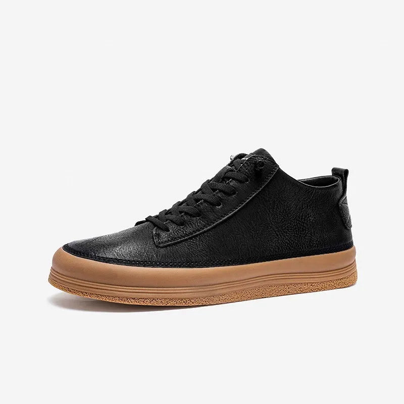 Men's black leather casual shoes with a round toe and white rubber sole on a plain background.