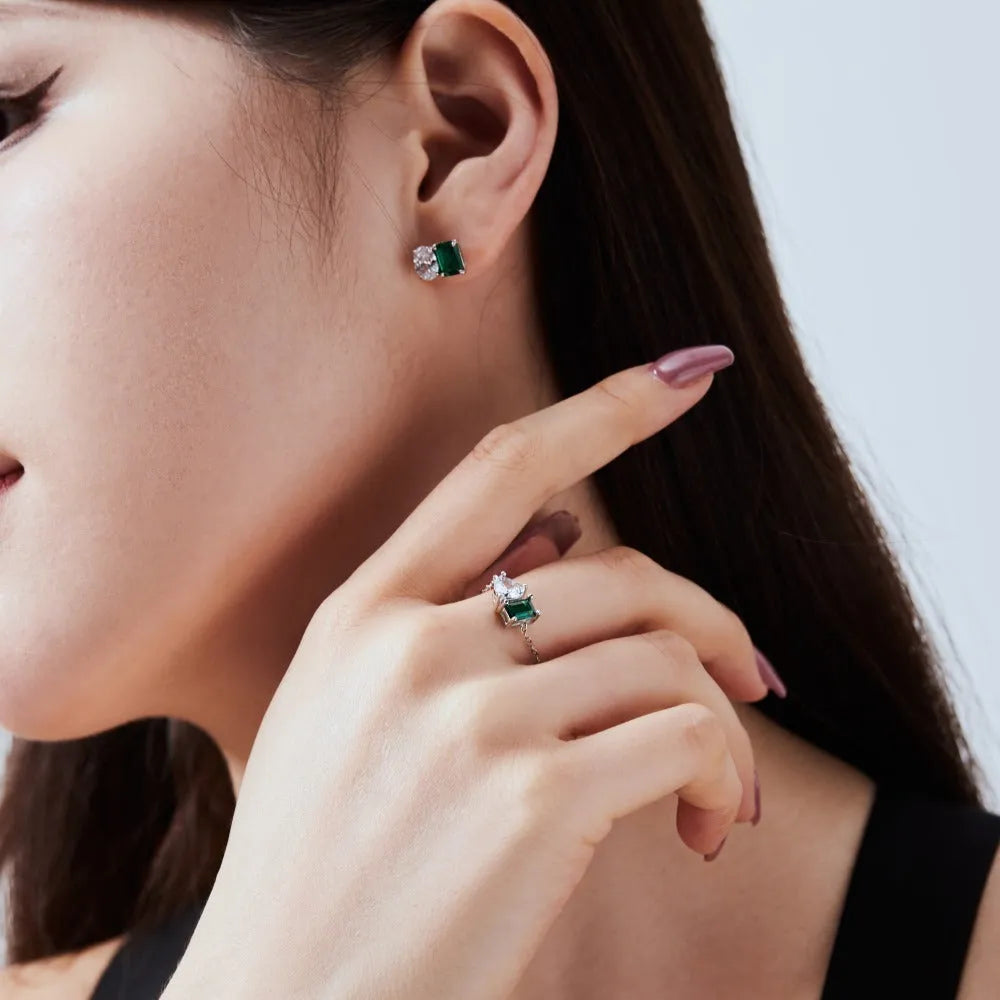 Silver stud earrings with emerald green stone in geometric ellipse and quadrilateral shape