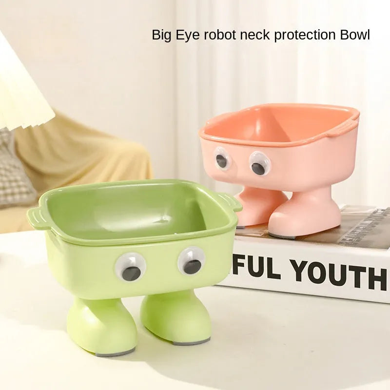 Green robot-shaped elevated cat bowl with tilted design and removable inner bowl on anti-slip base