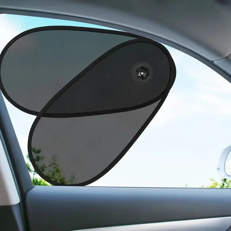 Black breathable car window shade with suction cups attached to a car side window for baby sun protection