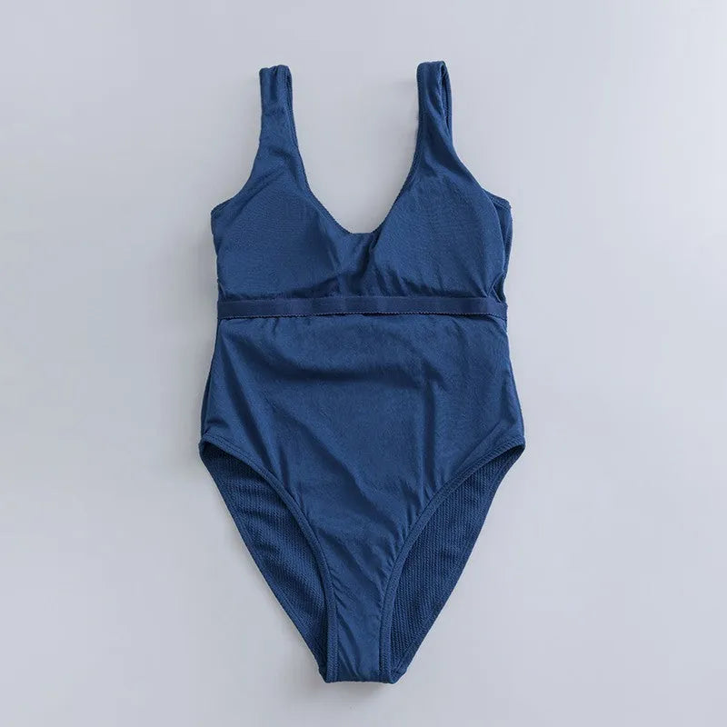Navy blue solid colour women's one-piece slimming swimsuit with triangle shape and removable chest pads.