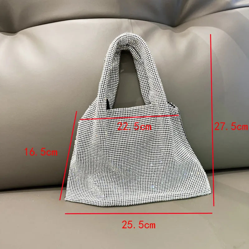 Silver ladies handbag with rhinestone embellishment on cotton thread construction and open outer pocket