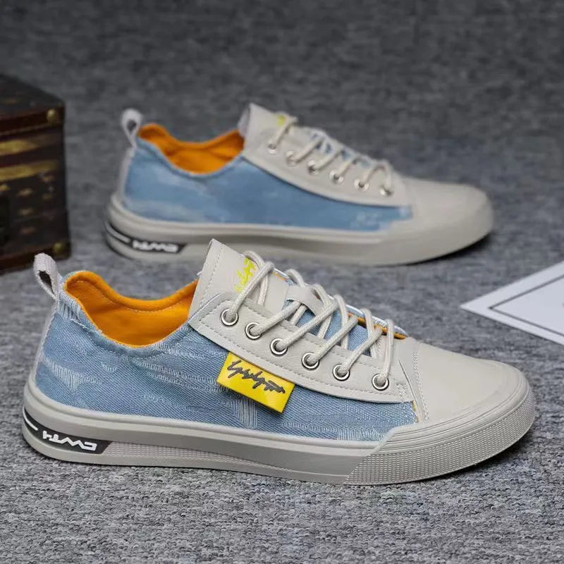 Men's casual canvas shoes in light blue with round toe, rubber sole, and lace-up closure.