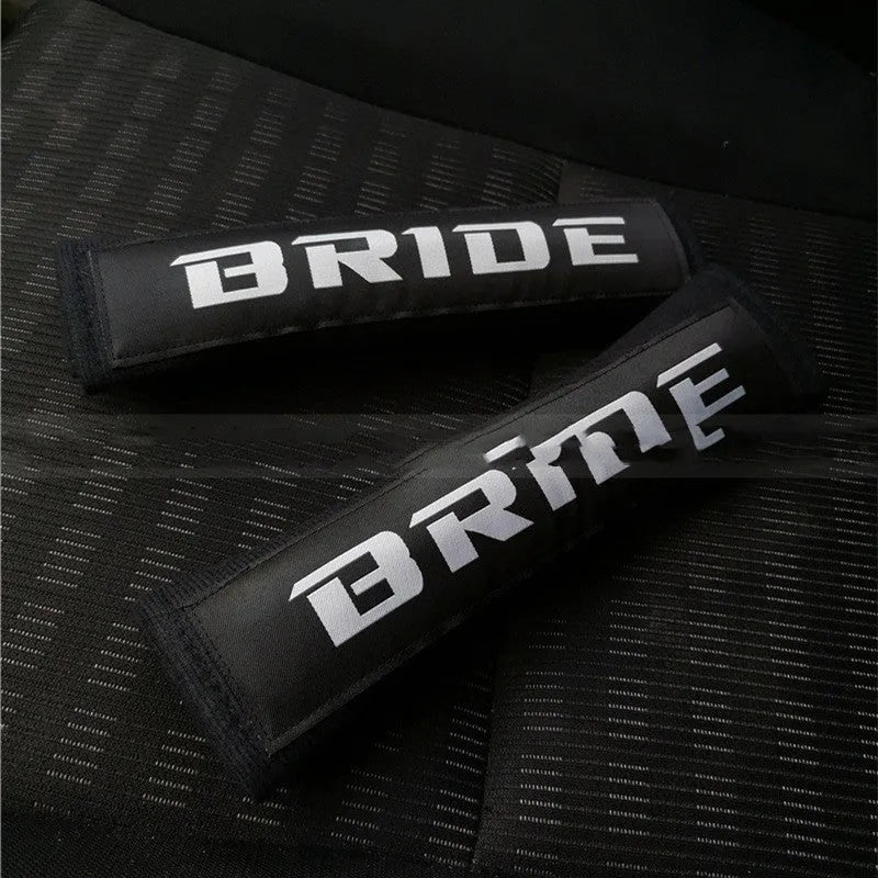 Car safety belt shoulder pad set in black showing cotton construction and embroidery detail