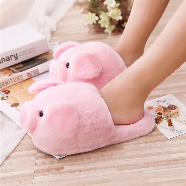 Pink pig plush floor slippers with soft short plush material and PP cotton filling.