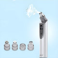 White ultrasonic vibration facial cleansing instrument with blackhead removal suction heads and 500MAH battery
