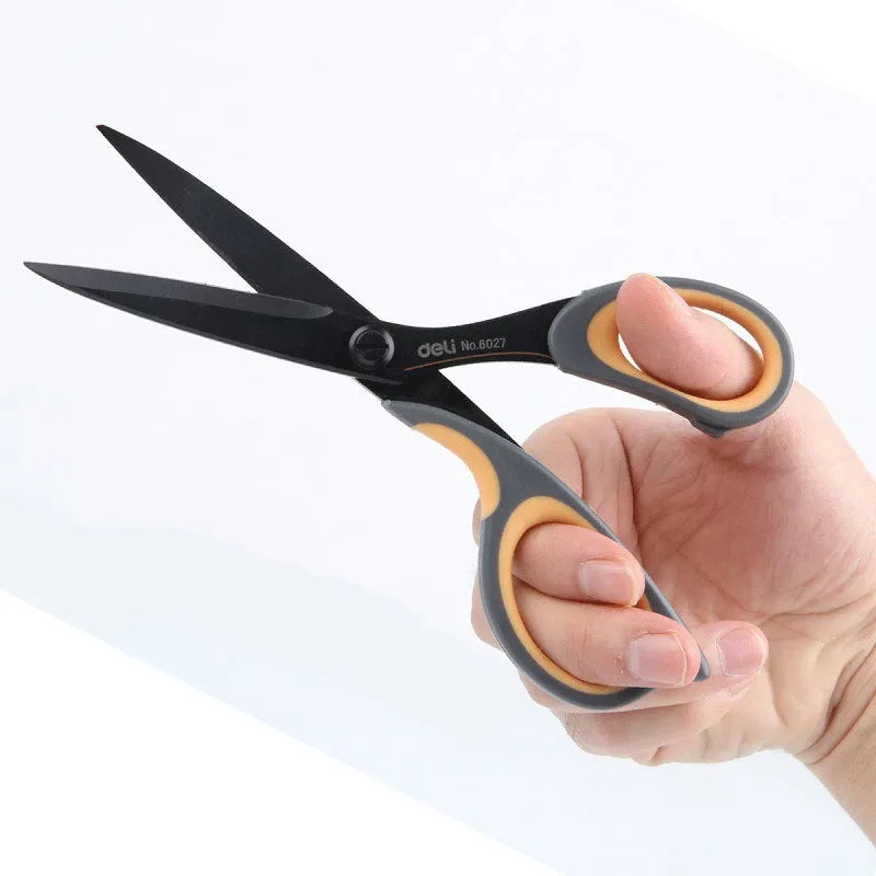 Black plastic handle alloy stainless steel scissors 175mm 6 inch blade on white background