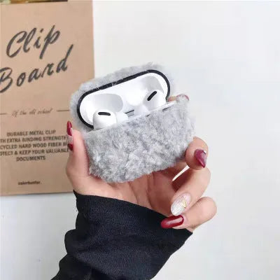 Green plush plastic headphone cover for Apple AirPods showing creative design elements