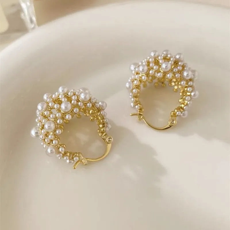 Gold floral basket earrings with pearl inlay and rice-shaped bead construction