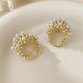 Gold floral basket earrings with pearl inlay and rice-shaped bead construction
