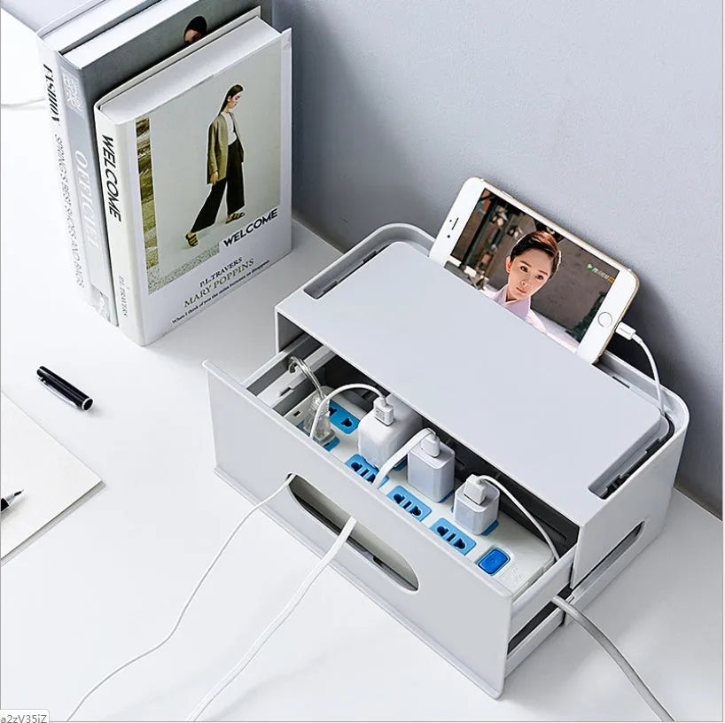 Grey and white plastic wireless router storage box with cable slots and ventilation holes.