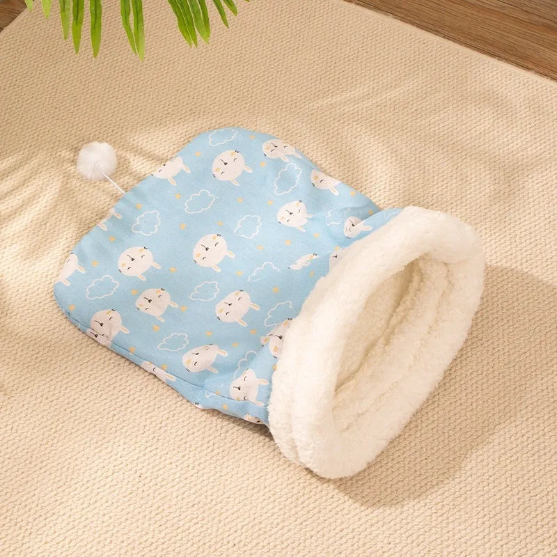 Soft pink Trojan patterned cat sleeping bag bed measuring 50cm by 40cm