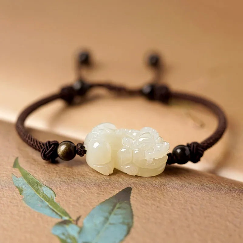Traditional Chinese Hetian jade bracelet with black and red braided ropes and jade beads on elastic cord