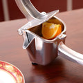 Silver heavy duty aluminium alloy lemon squeezer with extra large bowl on a kitchen counter