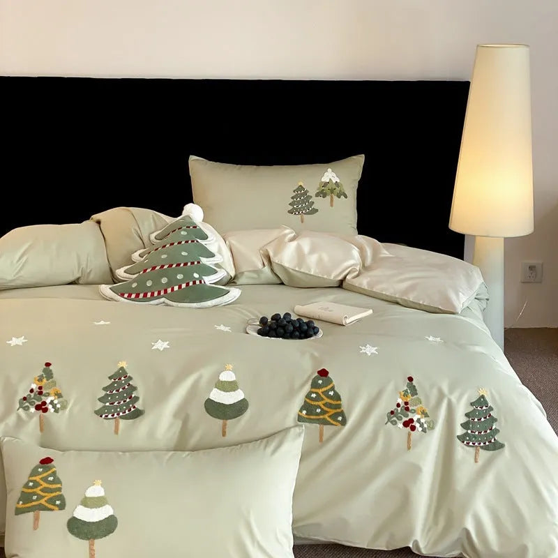 Pure cotton four-piece bed set with embroidered Christmas tree pattern in cream blue and green colours.