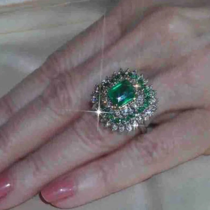 Emerald silver geometric metal ring ornament for women, shown on finger, size options available