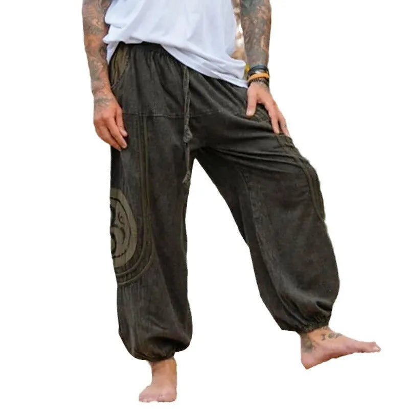 Men's dark green ethnic pattern trousers with elastic ankle ties, mid-waist design