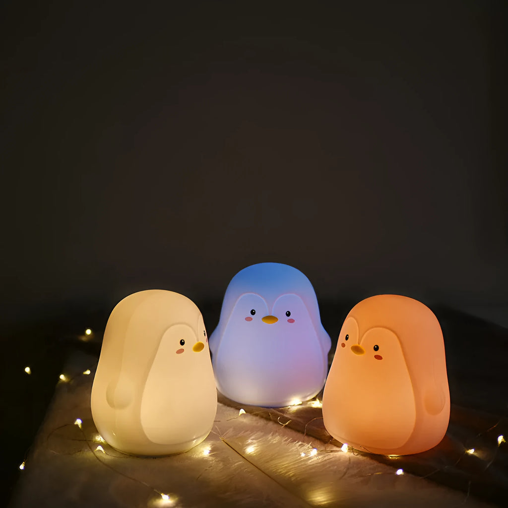 White penguin-shaped night light with USB rechargeable battery and soft LED illumination