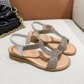 Gold women's patent leather beach sandals with rhinestone decoration on the straps.