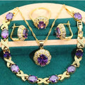 18k gold plated jewellery set showing ring, earrings, bracelet, and necklace with coloured cubic zirconia stones