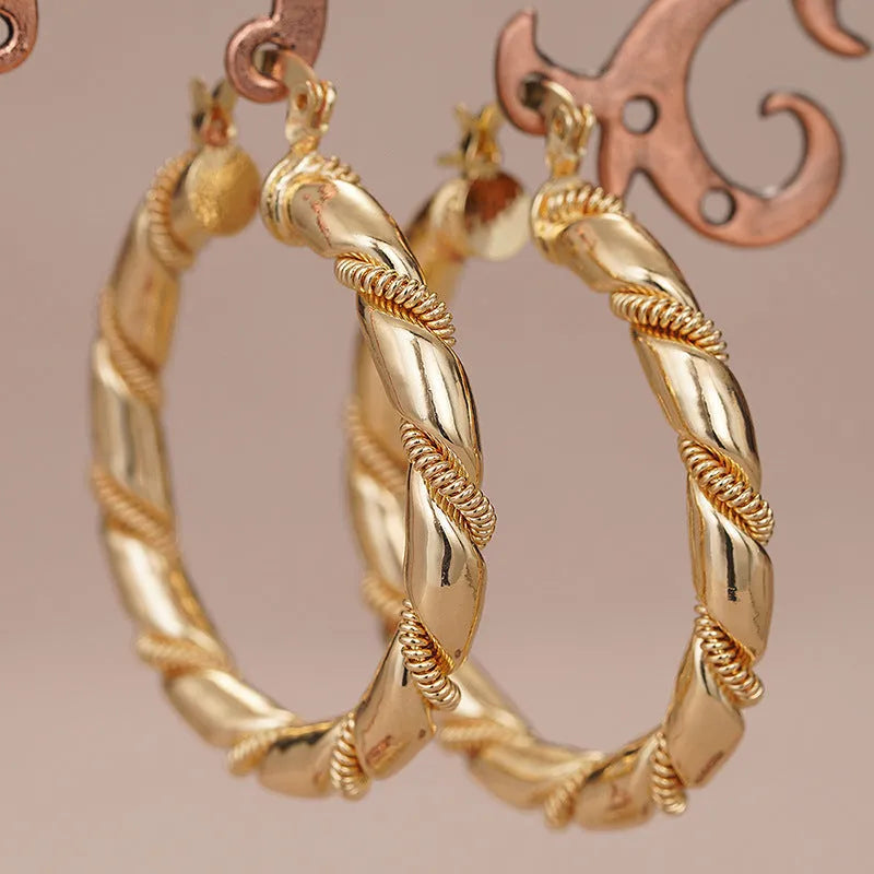 Women's geometric copper earrings with ring and line design in golden colours, ear clip style