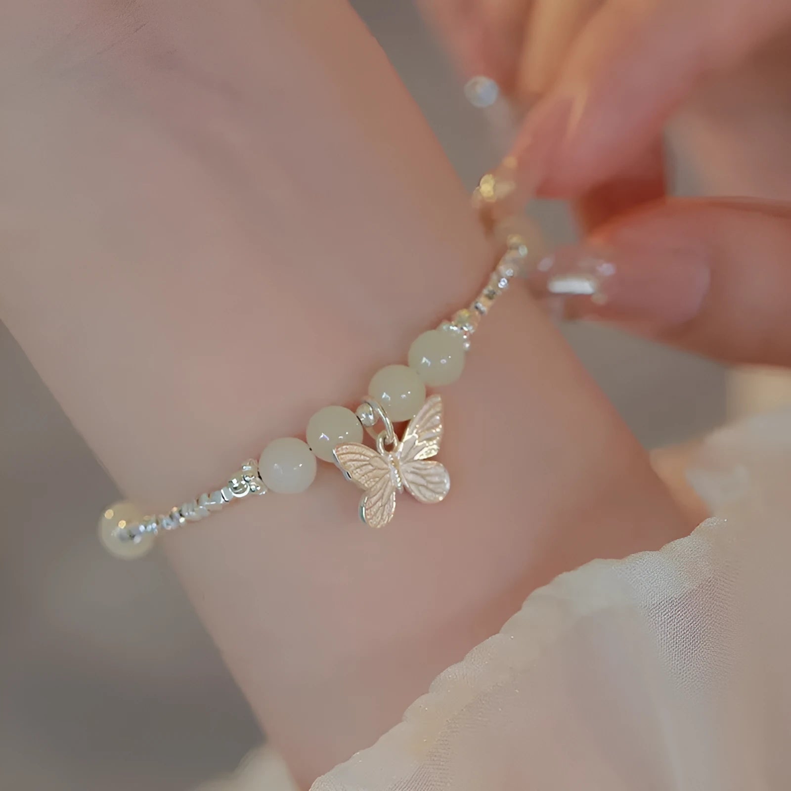 Silver butterfly necklace and bracelet set for women with electroplated copper construction