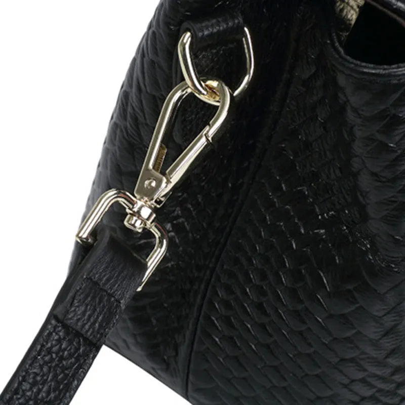 Genuine leather women's woven crossbody bag in black with embossed finish and soft handle