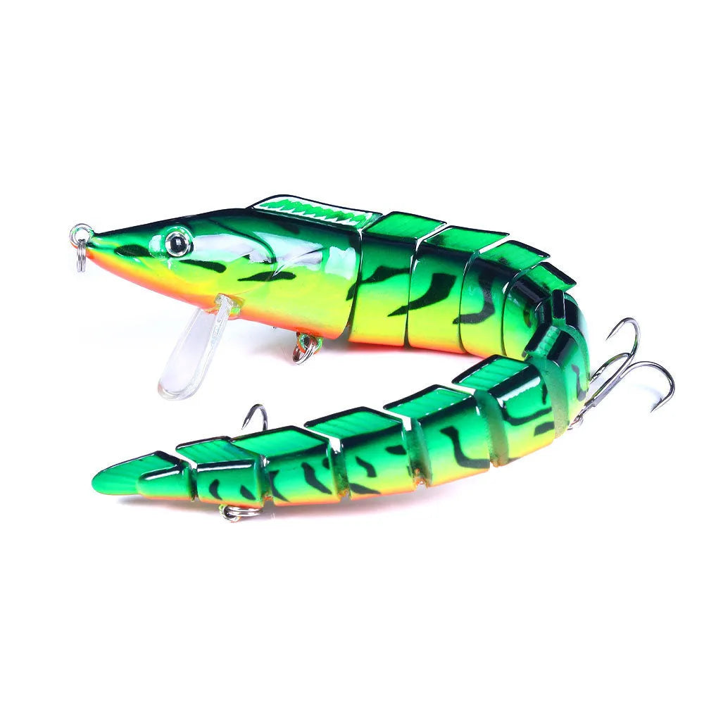 Multi-segment soft fishing lure mimicking a loach, shown in a realistic colour pattern with a visible hook.
