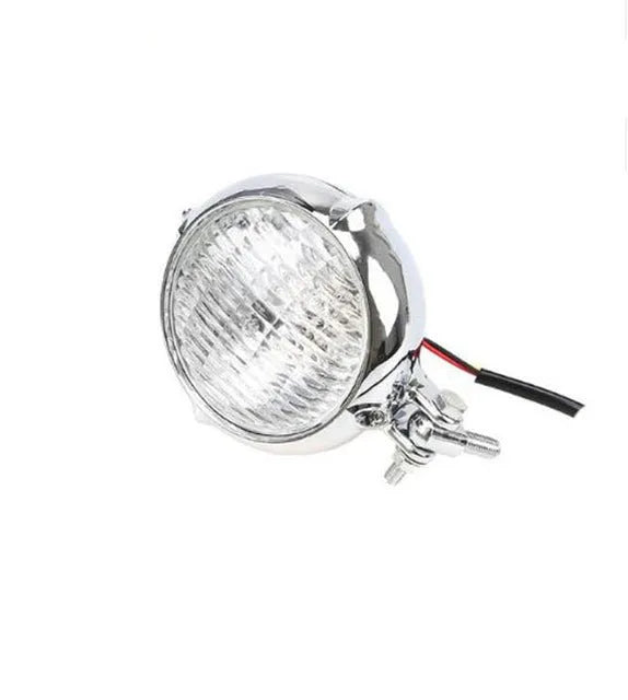 Black electroplated aluminium Harley halogen headlamp with 8cm diameter and yellow glass.