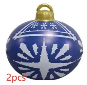Large red and white striped inflatable Christmas ball ornament hanging on an outdoor tree