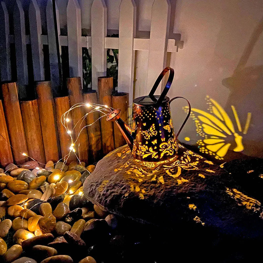 Solar garden lamp with tapered butterfly pattern iron frame and white LED light